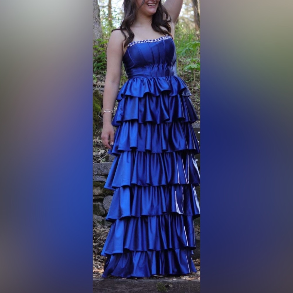 Blue Sleeveless Prom Dress with Tiered Ruffles and Pearl Neckline. Laced Back